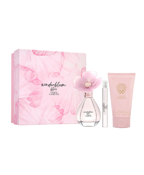The Vince Camuto Wonderbloom Bliss 3-Piece Set includes Eau de Parfum in a pink floral bottle with flower cap, a matching travel spray, and a pink scented lotion, all beautifully packaged.