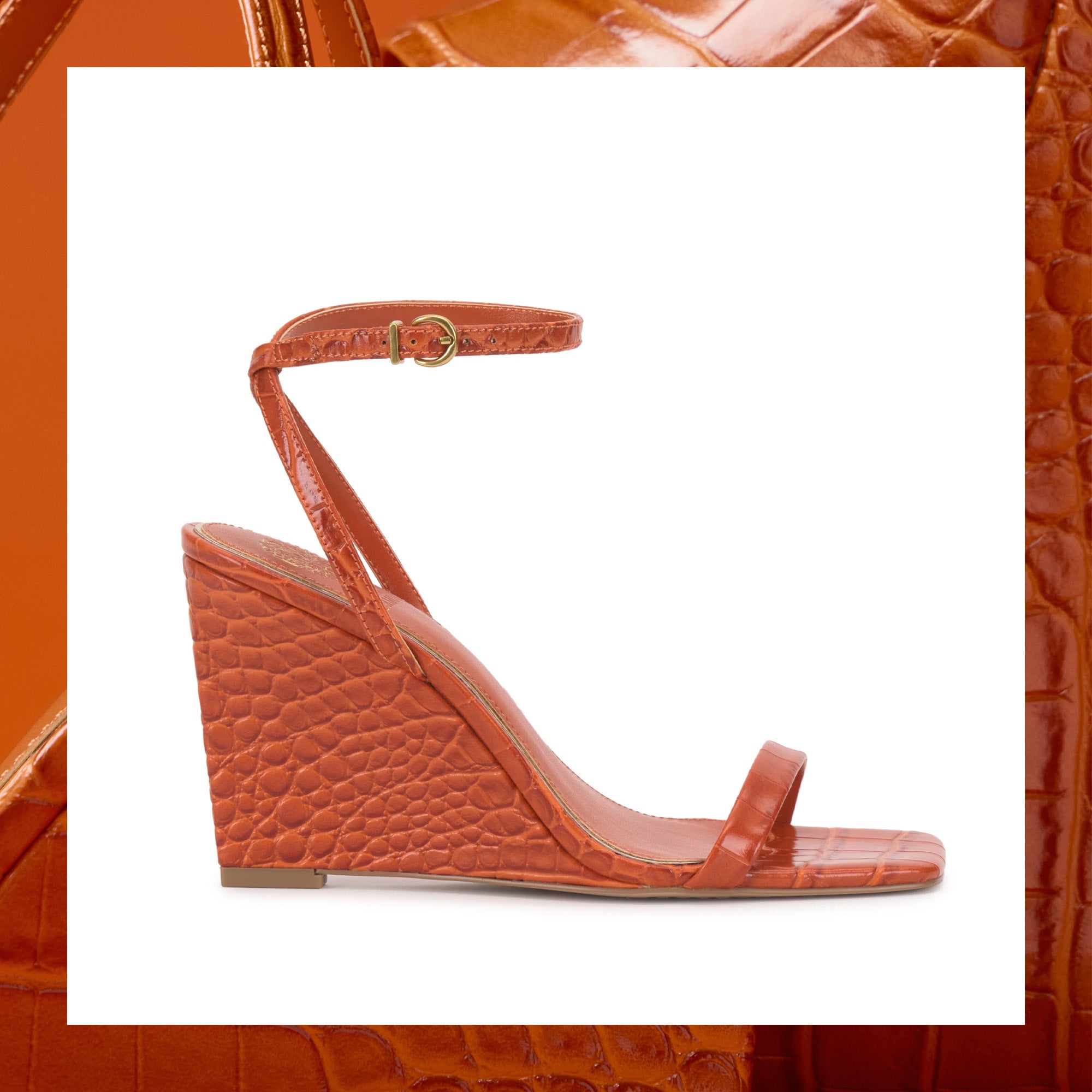 Orange wedge sandal with a textured strap on a white background