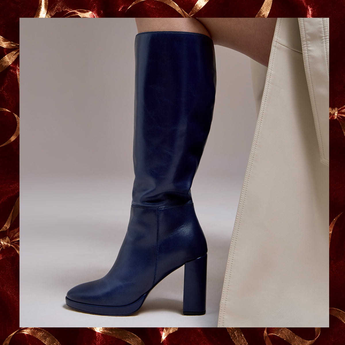 blue boots on a tan background with a red and gold border