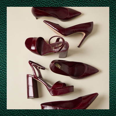 Multiple Plum colored heels with Green Cyber Week Background