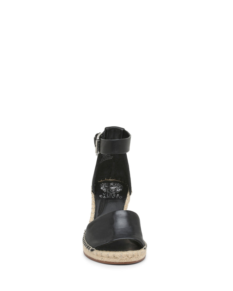 Front view of the Vince Camuto Leera Espadrille Wedge Sandal in black, featuring an open toe, ankle strap with buckle, and espadrille-style jute wedge sole.