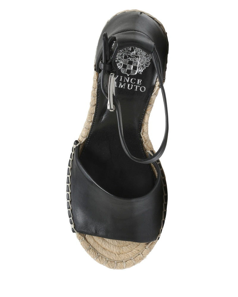 The Vince Camuto Leera Espadrille Wedge Sandal is a black open-toe style featuring an ankle strap, a jute-wrapped sole with edge stitching, and a silver Vince Camuto logo on the insole.