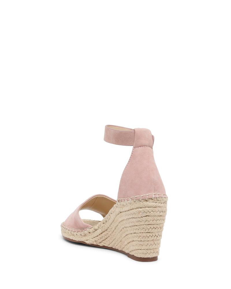 The Vince Camuto Leera Espadrille Wedge Sandal is shown from the back on a white background, featuring a pink suede finish, an ankle strap, and a jute-wrapped platform.
