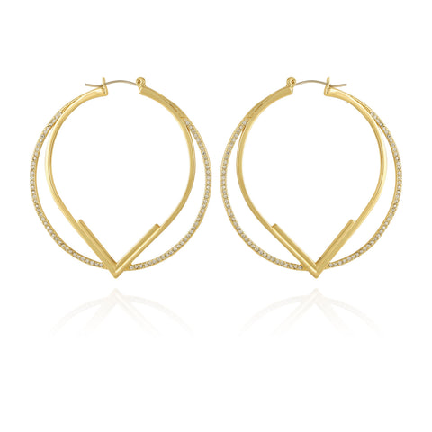 The Vince Camuto Double Hoop V Pave Earrings feature a gold V-shaped design with a thinner pave hoop accented by clear stones on the outer edge, all elegantly showcased against a white background.