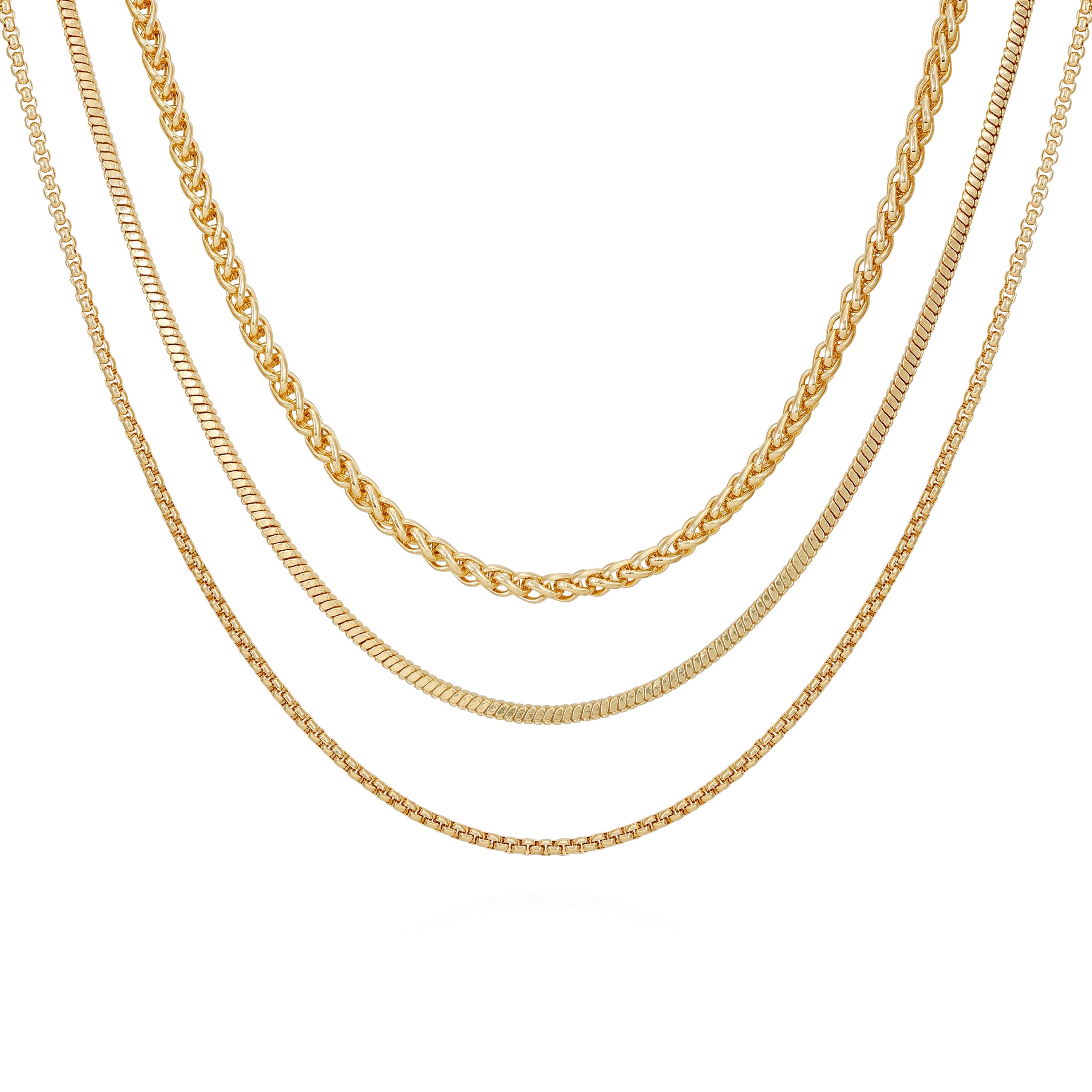 The Vince Camuto Goldtone 3 Piece Mixed Chain Layered Necklace Set showcases twisted, box, and curb chain designs—three gold-tone necklaces in varied styles layered on a white background for an elegant jewelry collection addition.
