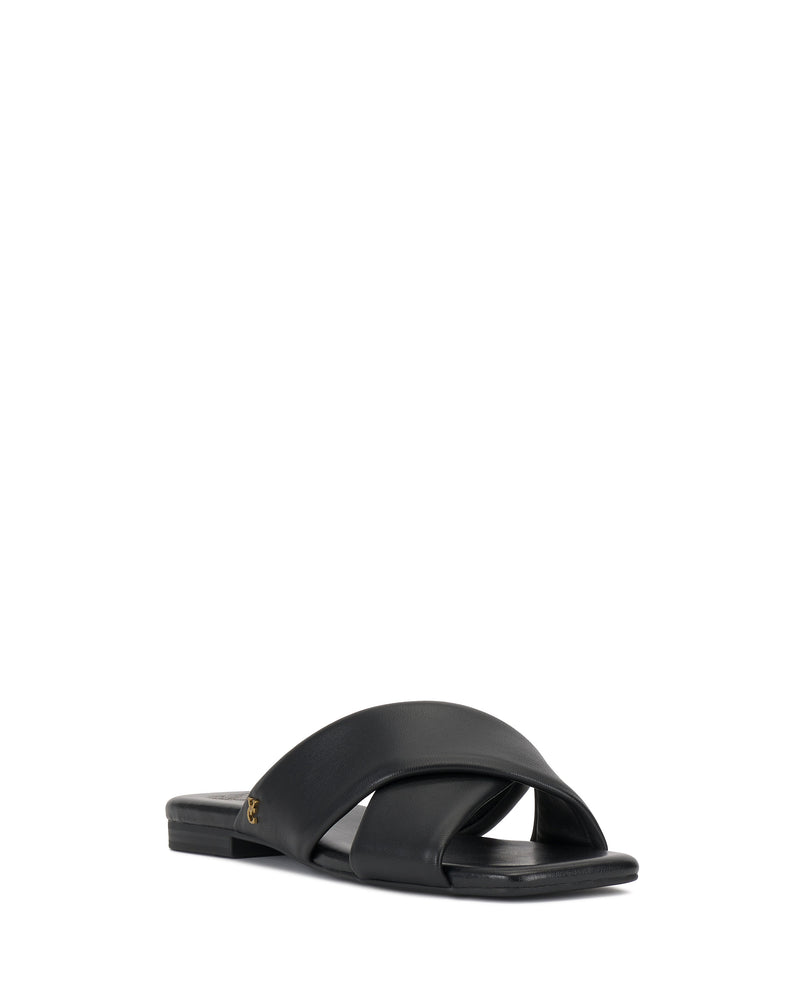 The Vince Camuto Adisey Cross-Band Sandal features wide crisscross straps and a flat sole for comfort and style, making it ideal for everyday wear. Displayed in black at an angle on a white background, this slide is practical and chic.