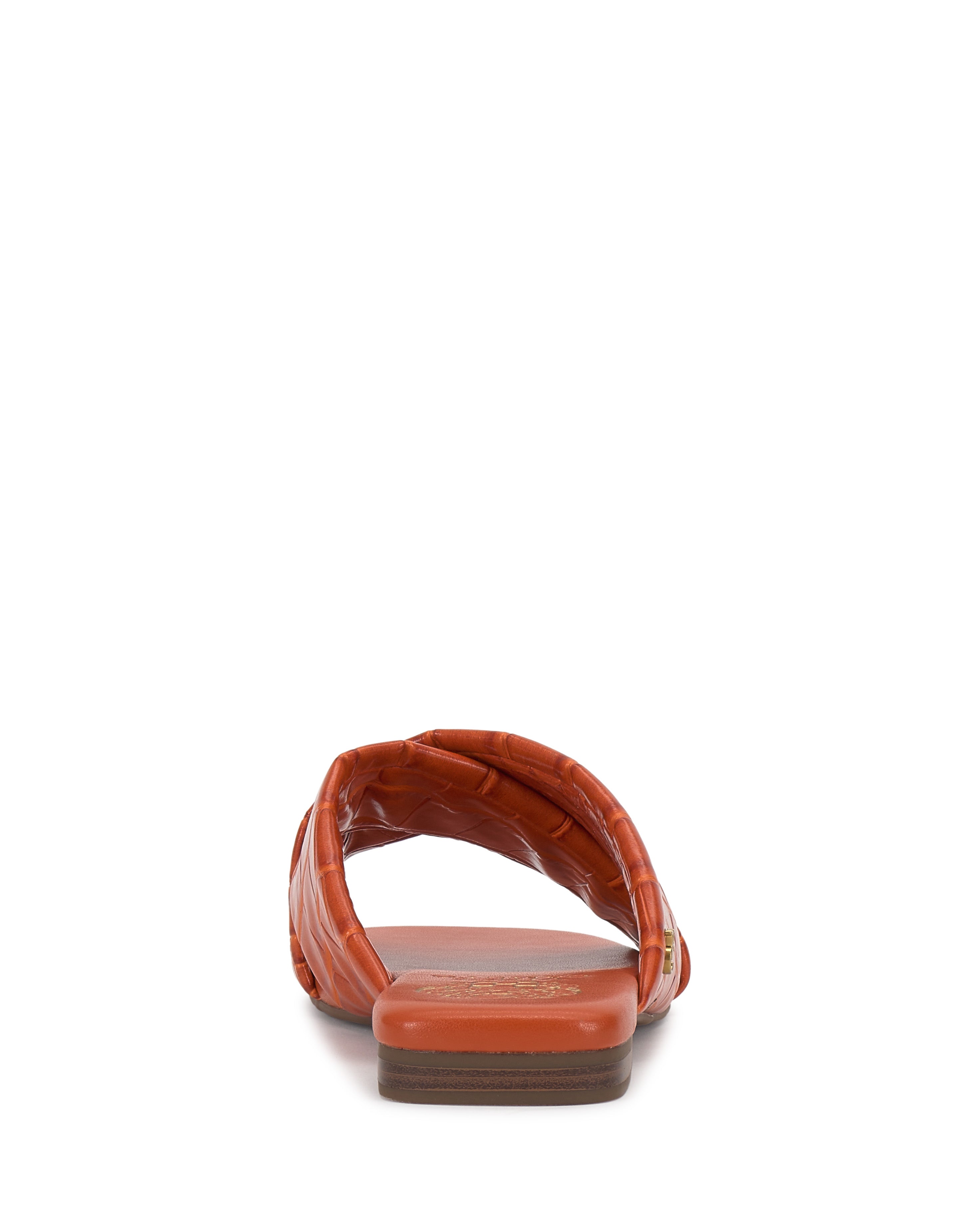 A back view of a single orange Vince Camuto Adisey Cross-Band Sandal with a textured wide strap and low heel, designed for everyday wear, shown against a plain white background.