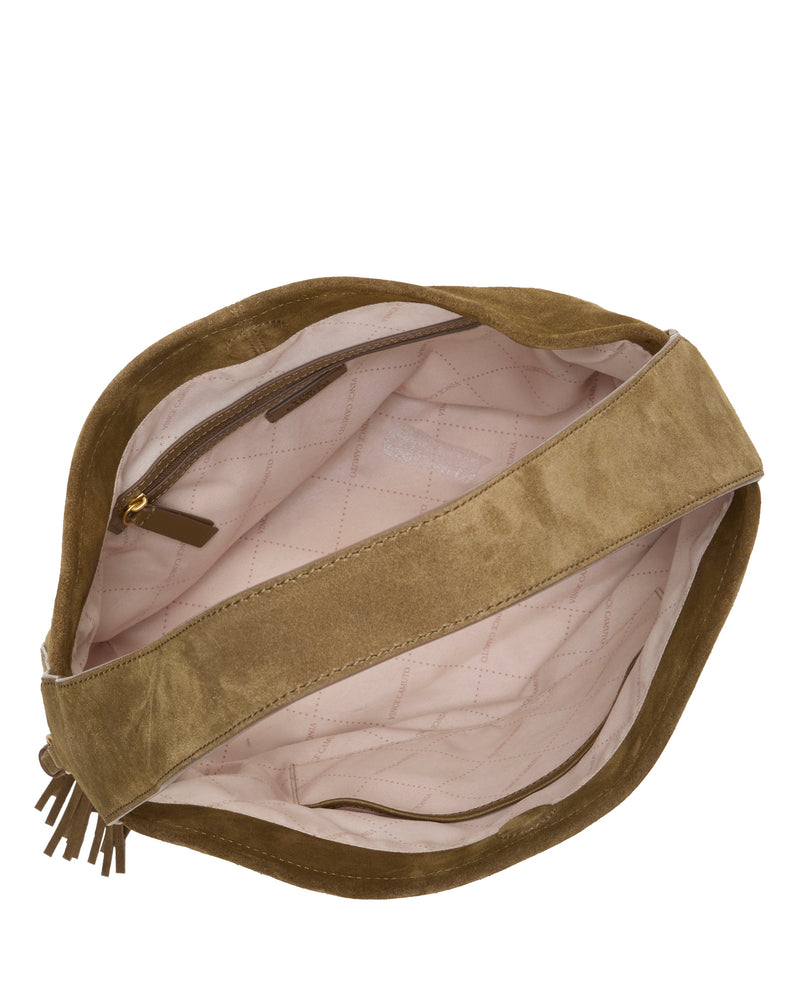 Top view of an open Aleah Shoulder Bag by Vince Camuto, featuring tan suede with a wide strap, light pink quilted fabric lining, an inner zippered pocket, and a tassel zipper pull—an ideal fall accessory.