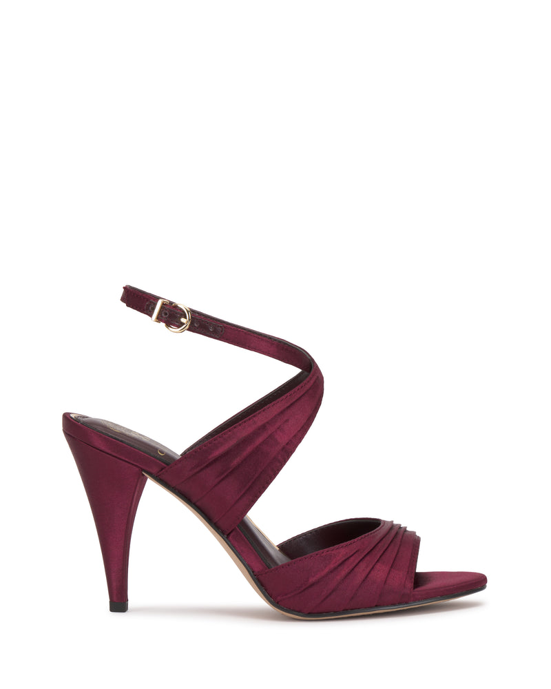 A burgundy Altnori Sandal by Vince Camuto with an ankle strap, crisscross design, pointed heel, and open toe is displayed on a white background.