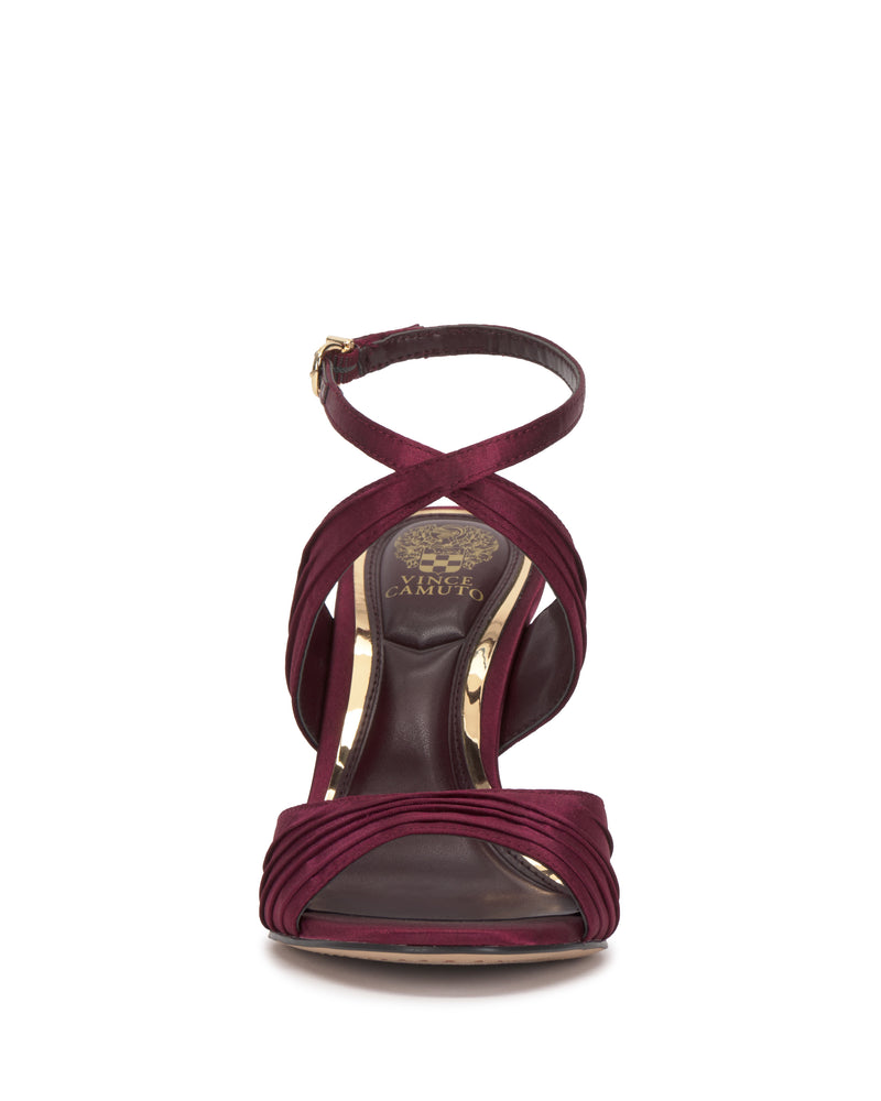 A burgundy Vince Camuto Altnori Sandal with a strappy design, ankle strap, and gold insole logo, viewed from the front against a white background.