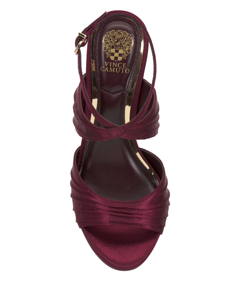 Burgundy satin Altnori Sandal by Vince Camuto with ruched straps and ankle buckle, seen from above. Features an elegant heel and the Vince Camuto logo on the insole.
