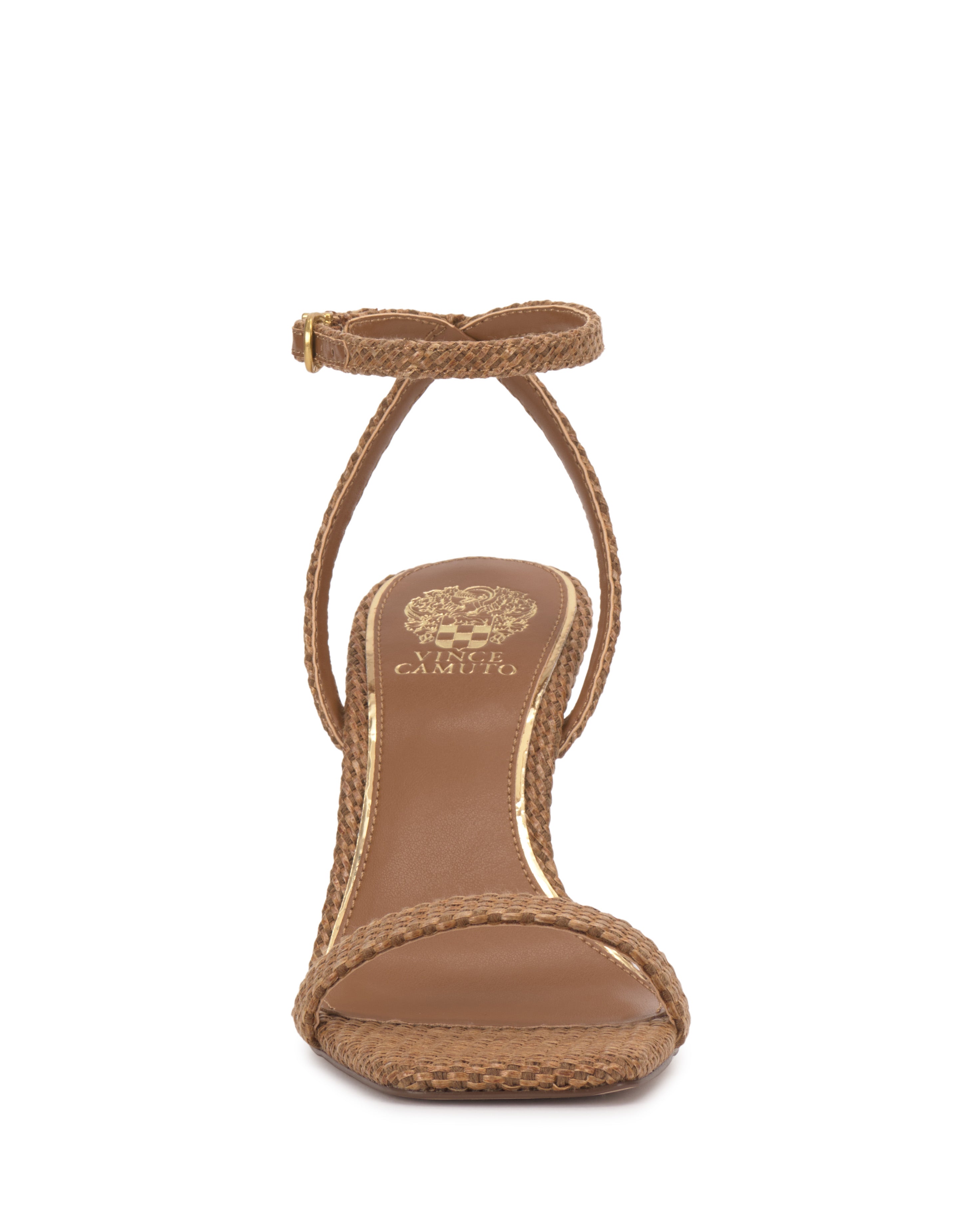 Front view of the Vince Camuto Ambee Wedge Sandal in brown, featuring a square toe, single toe strap, ankle strap with gold buckle, woven texture, and a gold logo on the insole—ideal for formal events.