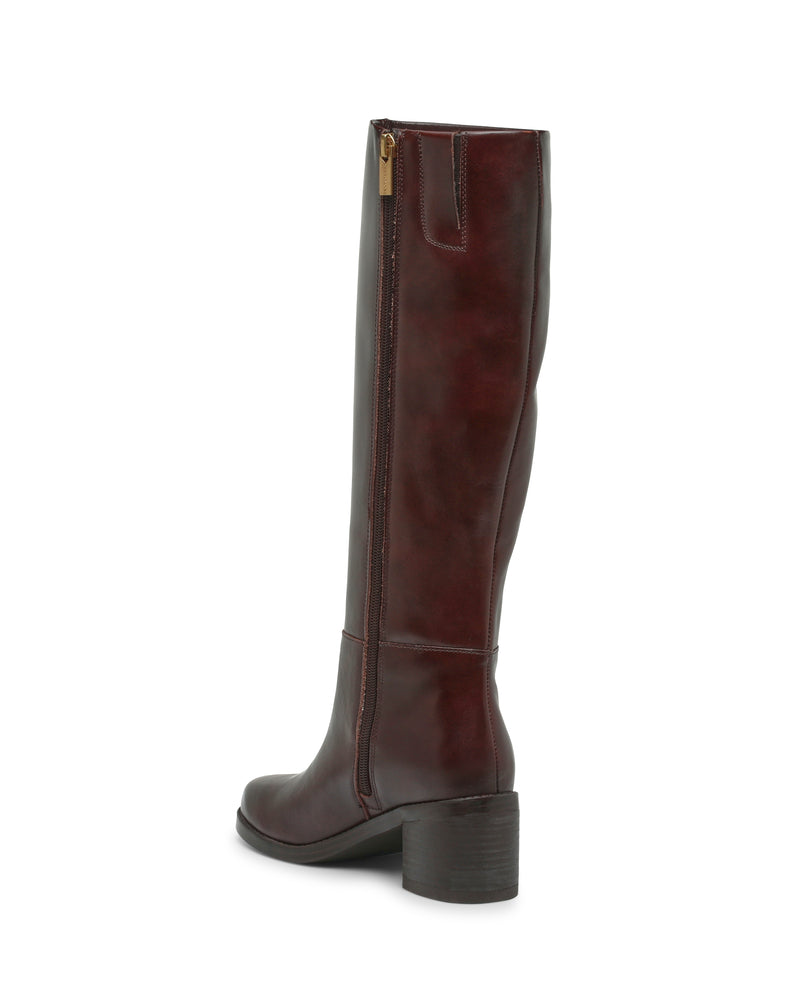 The Vince Camuto Ammar Extra Wide Calf Knee High Boot is a tall, dark brown leather boot with a side zipper, low block heel, and slightly rounded toe, pictured from the side against a white background—an effortless staple for any casual wardrobe.