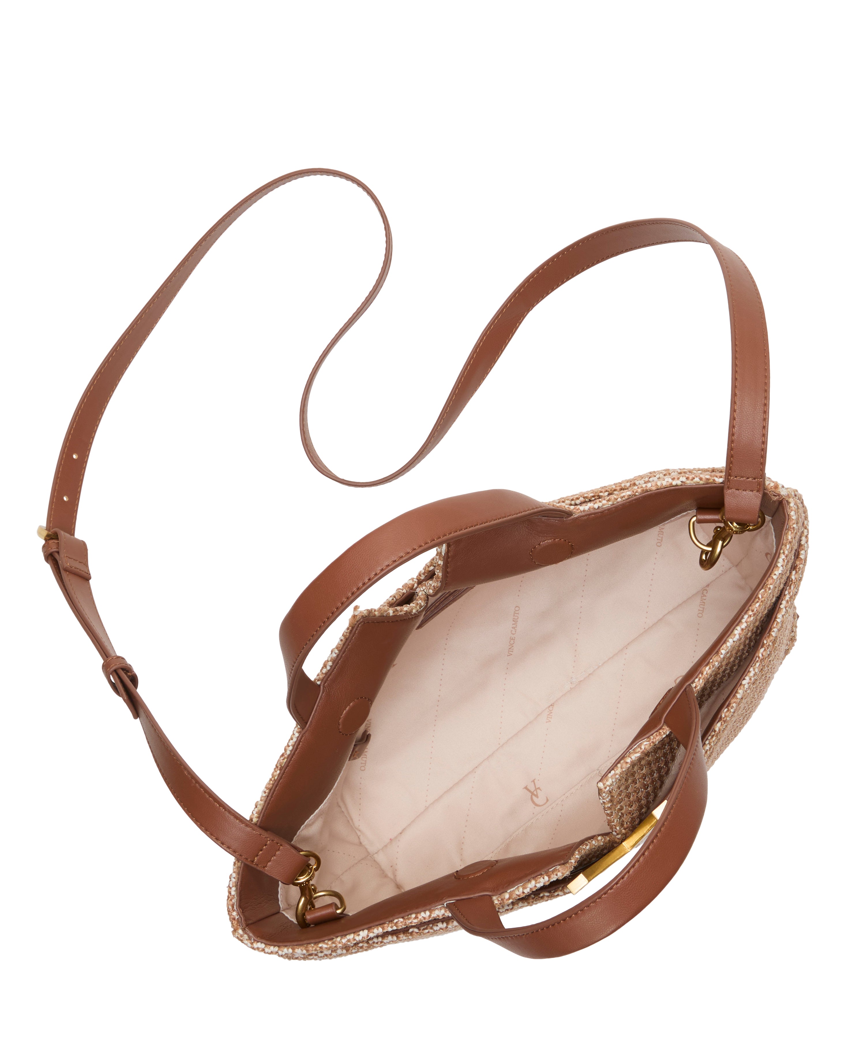 Top view of the Vince Camuto April Satchel Bag in brown leather, featuring dual handles, a long adjustable strap, and a light quilted fabric interior with small side pockets.