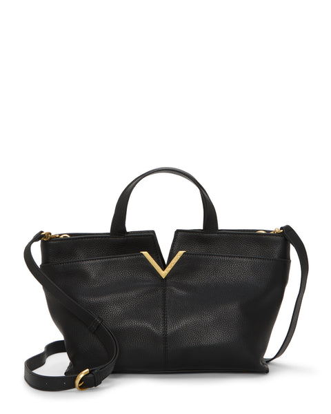 The Vince Camuto April Satchel Bag is a black leather handbag with a textured finish, top handles, a detachable shoulder strap, and a gold V-shaped accent at the top center.