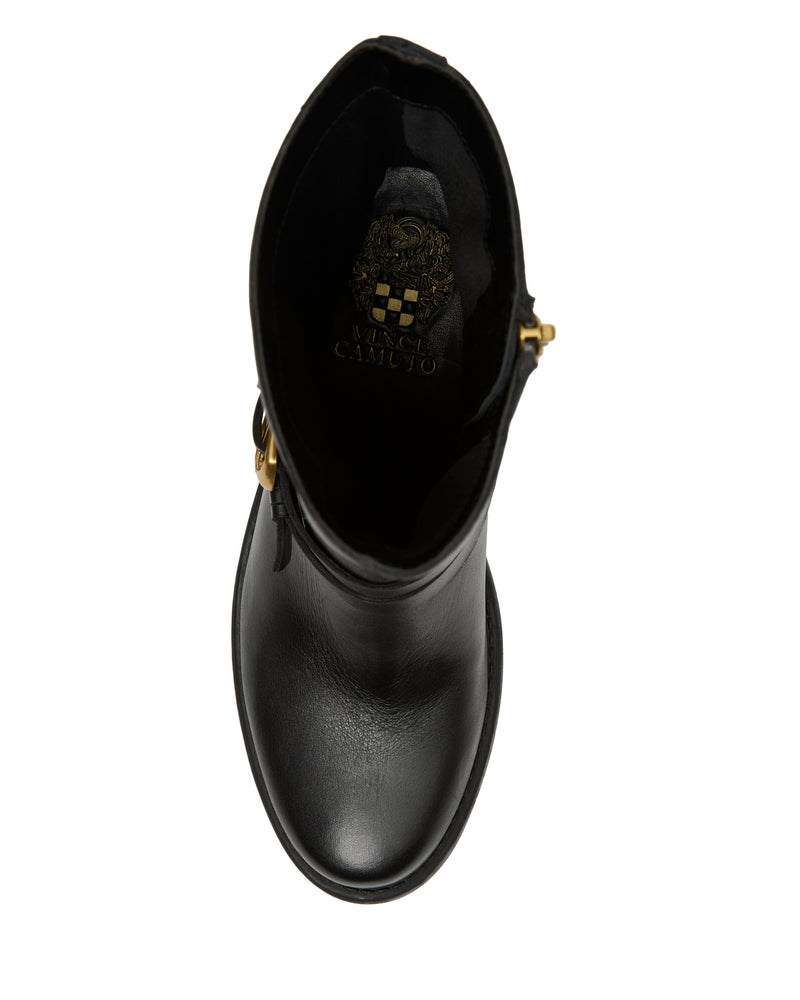 Top view of the Vince Camuto Armia Bootie in black leather, featuring a rounded toe, block heel, and gold buckle harness detail, with the interior logo and crest design visible on the insole.