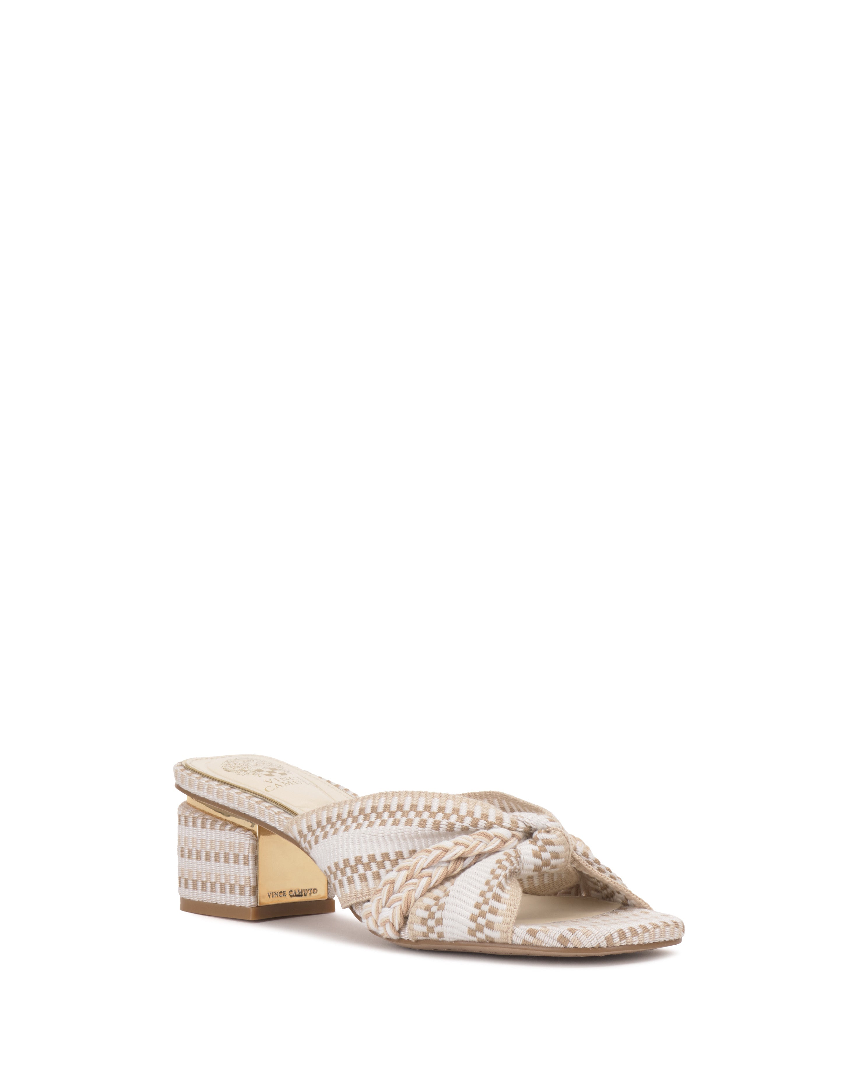 The Vince Camuto Atemly Knotted Sandal features a beige and white woven upper with a knot detail, open toe, chunky block heel, bohemian accents, and a gold nameplate on the heel.
