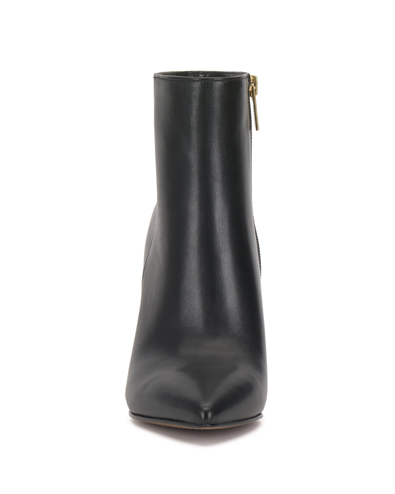Front view of the Vince Camuto Attiza Bootie, a black leather high heel ankle bootie with a pointed toe and side zipper with gold pull, shown against a white background.