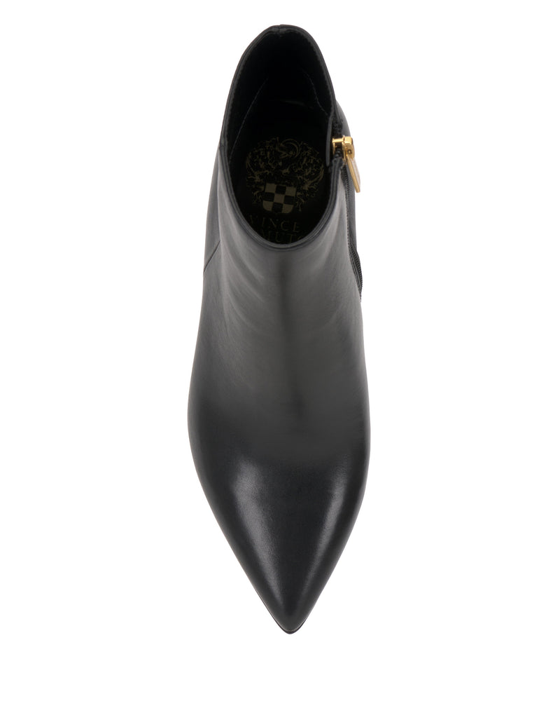 Top view of the Vince Camuto Attiza Bootie, a black pointed-toe ankle boot with a side zipper featuring a gold pull, shown on a white background.