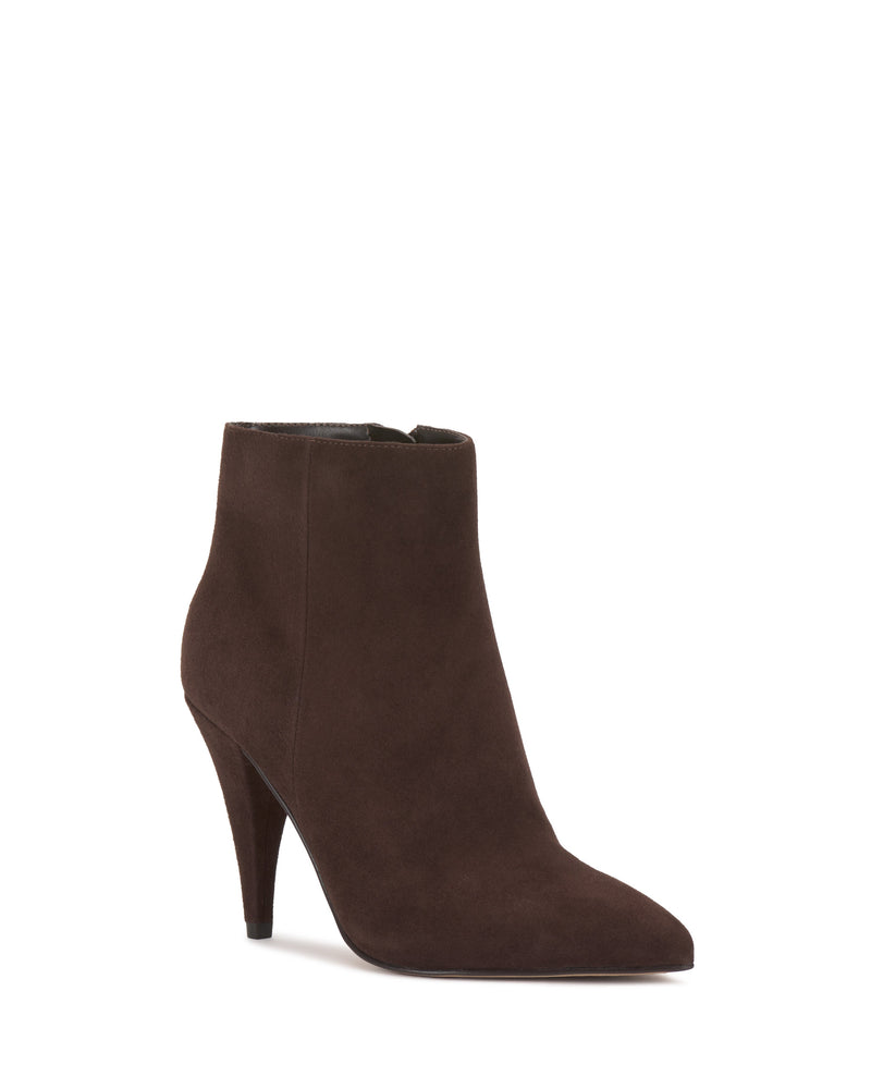 The Vince Camuto Attiza Bootie is a dark brown suede ankle boot with a pointed toe and high, tapered heel, set against a plain white background.