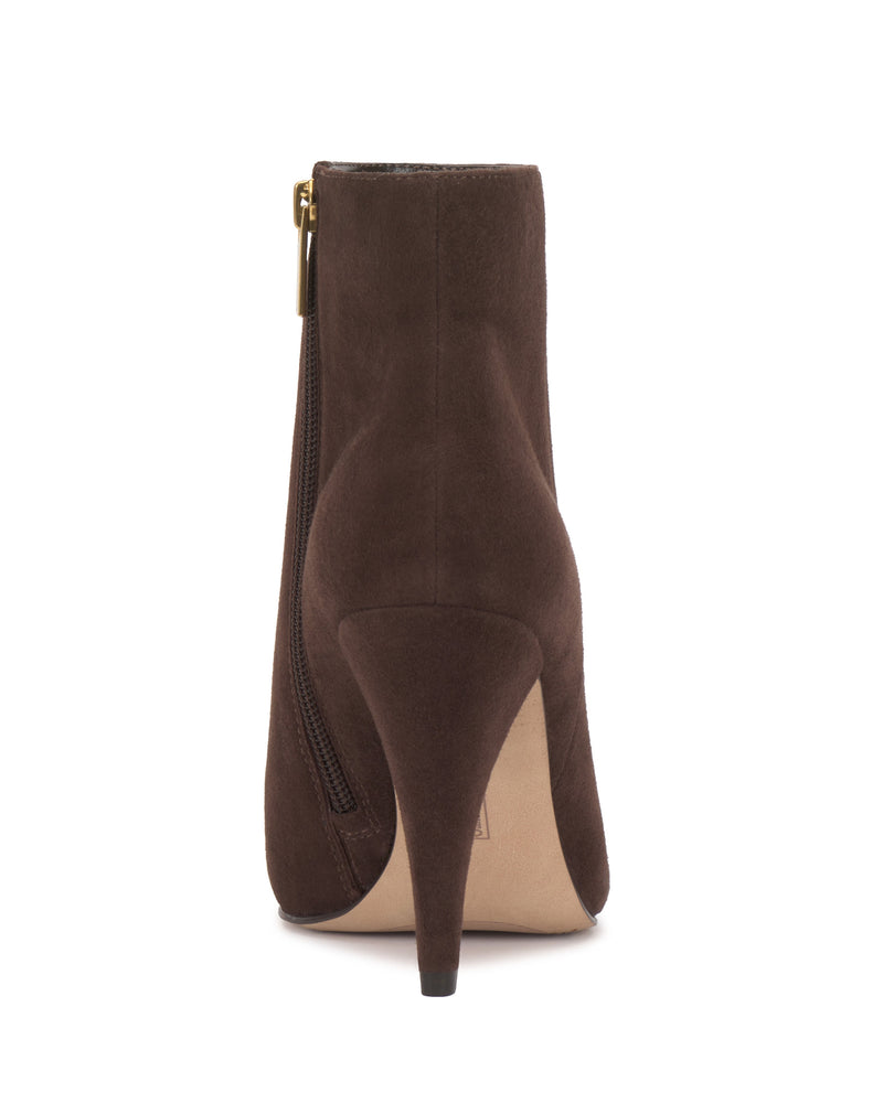 The Attiza Bootie by Vince Camuto features a brown suede finish, pointed toe, visible side zipper, and slim high heel shown from the rear view.