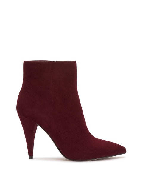 The Attiza Bootie by Vince Camuto is a burgundy suede ankle bootie featuring a pointed toe and high stiletto heel, displayed in side profile against a white background.