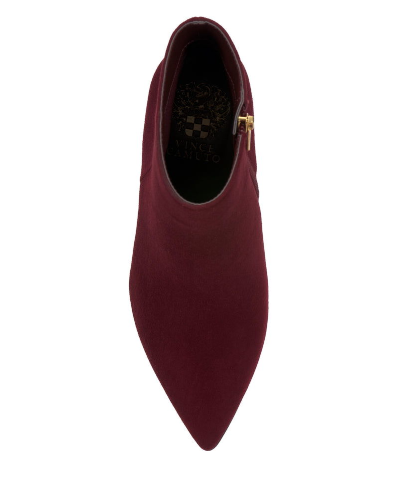 Top view of the Vince Camuto Attiza Bootie—a burgundy, pointed toe ankle bootie with a side zipper and dark inner lining—set against a white background.