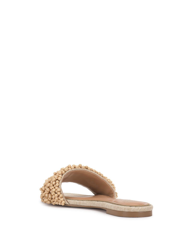 The Vince Camuto Balea Beaded Sandal features a wide beige strap with clustered beading, shown from the rear against a white background—an ideal versatile footwear choice for any occasion.