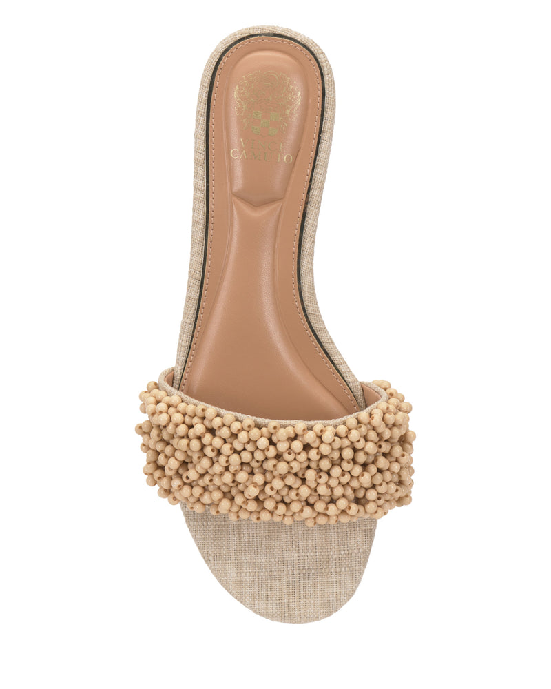 The Balea Beaded Sandal by Vince Camuto features a cushioned tan insole and a wide textured fabric strap with small round beaded accents—an ideal versatile beige flat for any occasion.