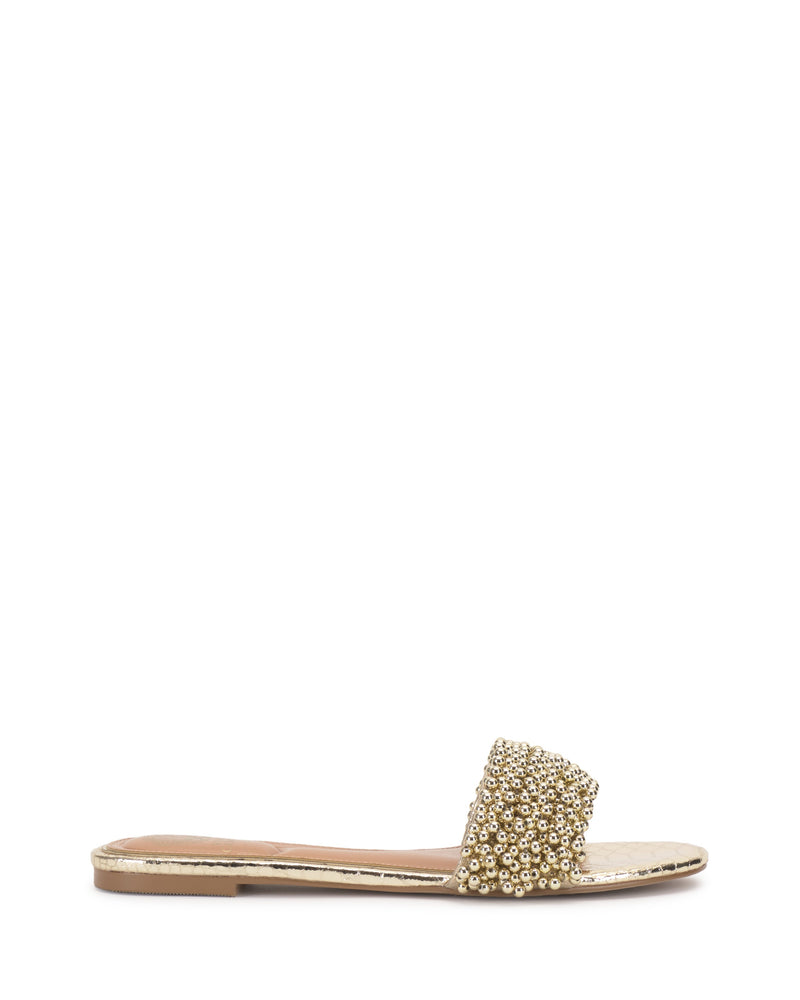 The Vince Camuto Balea Beaded Sandal features a gold flat design with a single wide beaded strap, thin sole, and open back—versatile footwear for any occasion, shown on a white background.