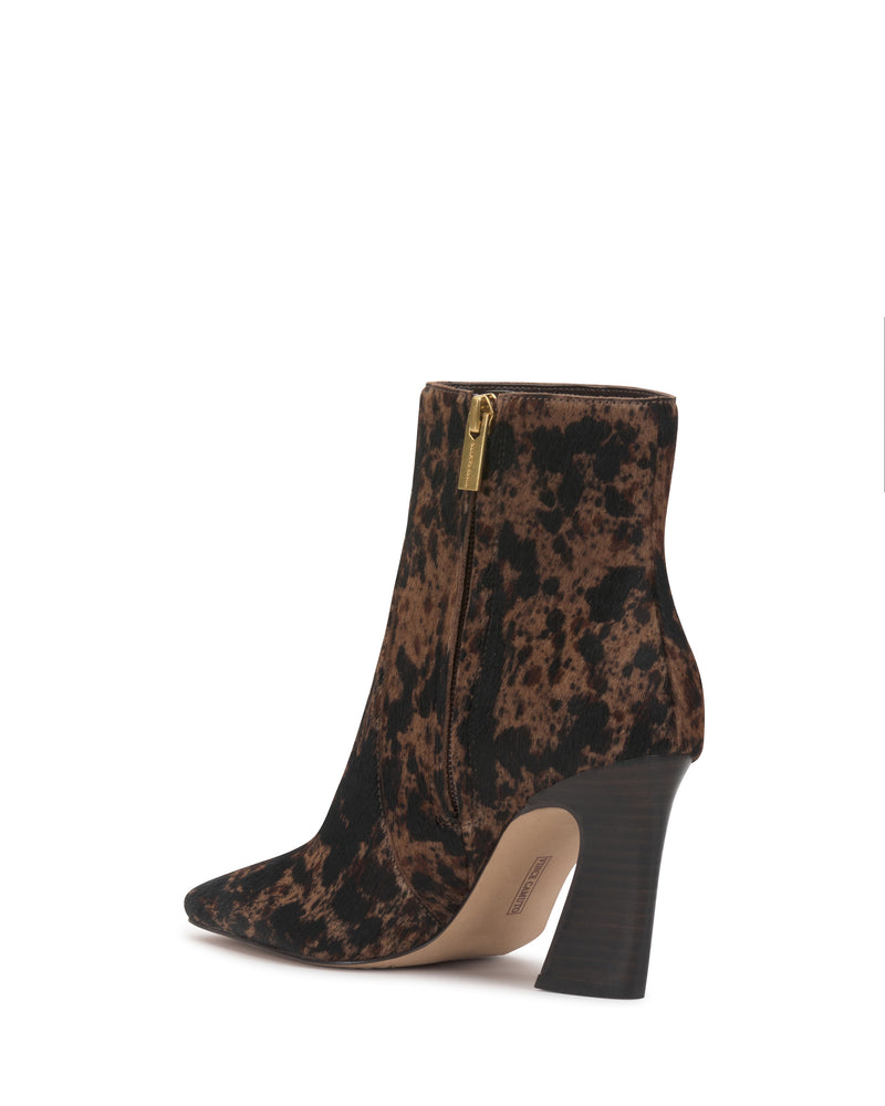 The Vince Camuto Bayla Bootie features a brown and black animal print, pointed toe, side zipper, and high block heel against a white background.