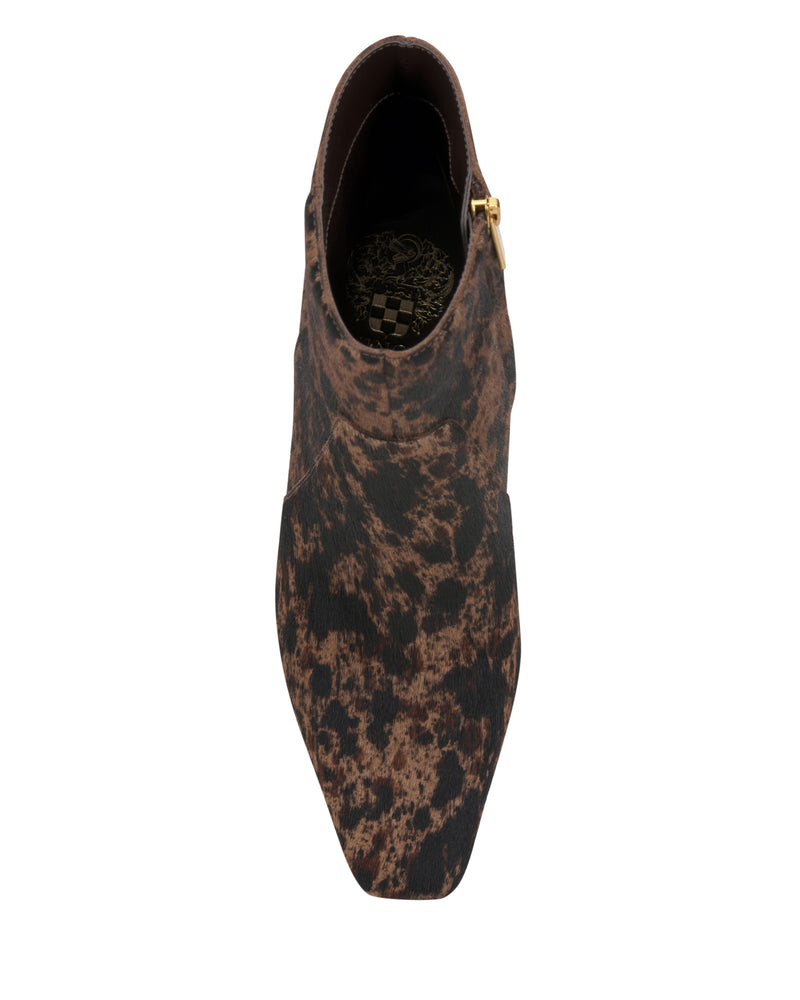 Top view of the Vince Camuto Bayla Bootie, featuring a brown, square-toe design with a black and brown speckled pattern, side zipper, and decorative insole detail, shown on a white background.