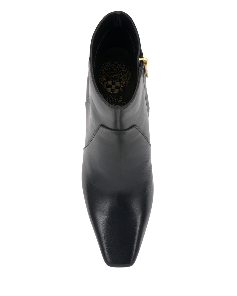 The Vince Camuto Bayla Bootie, crafted in black leather with a square toe, is shown from above against a white background. A gold buckle accent adorns the side, while the Vince Camuto logo is printed inside the shoe’s heel—an ankle boot designed for effortless style.