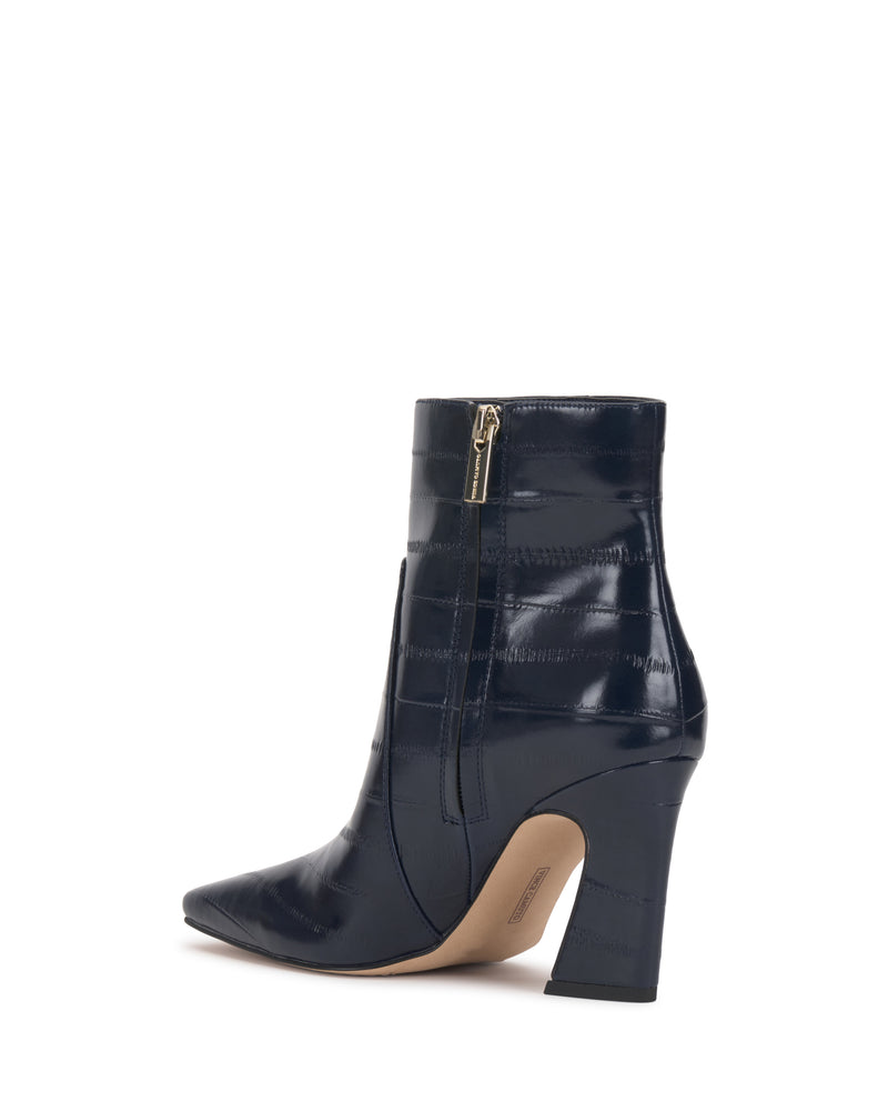 Navy blue Bayla Bootie by Vince Camuto featuring a pointed toe, side zipper, textured shiny finish, and block heel. This ankle bootie boasts a sleek, modern design.