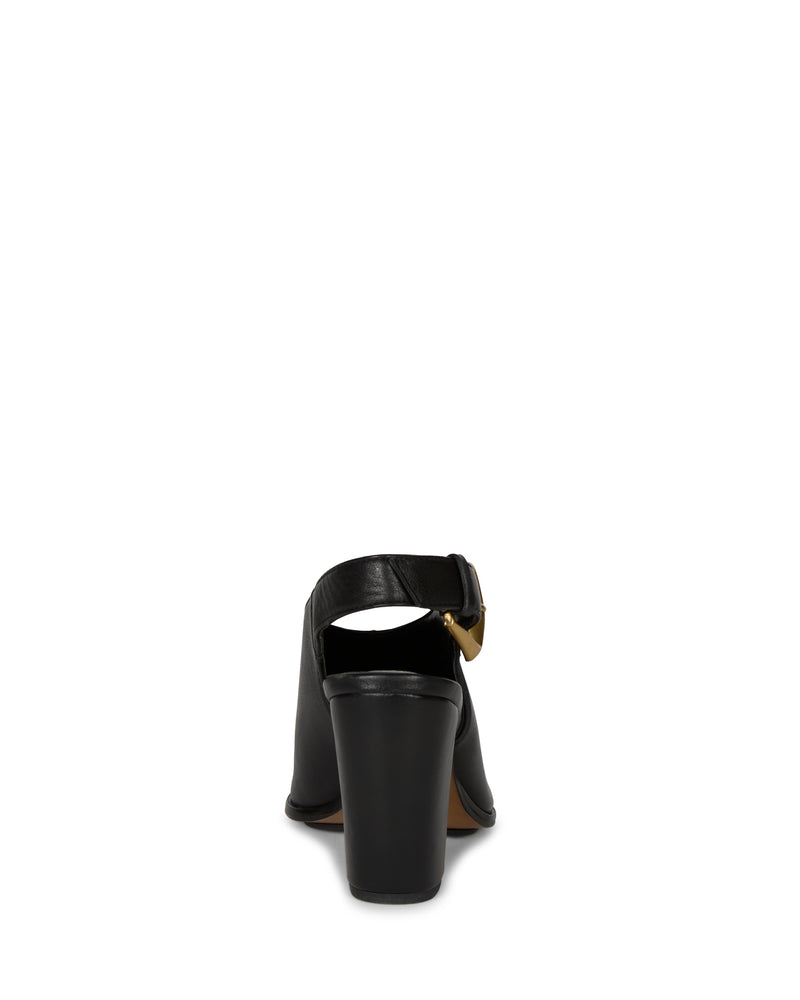 A rear view of the Vince Camuto Baylez Buckled Mule, a black high-heeled shoe with a thick heel and an ankle strap with a gold buckle, set against a plain white background.