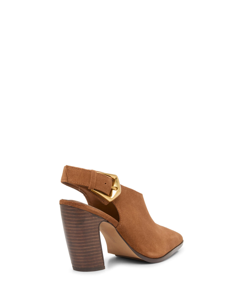 The Vince Camuto Baylez Buckled Mule features brown suede, a stacked block heel, pointed toe, and a wide side strap with a large gold buckle. Shown from the rear side against a white background.