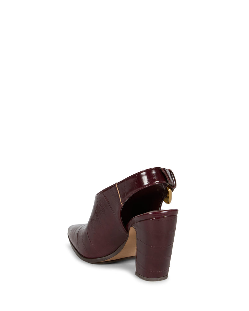 The Vince Camuto Baylez Buckled Mule is a burgundy, high-heeled mule with a pointed toe and textured pattern, shown from the back on a white background.