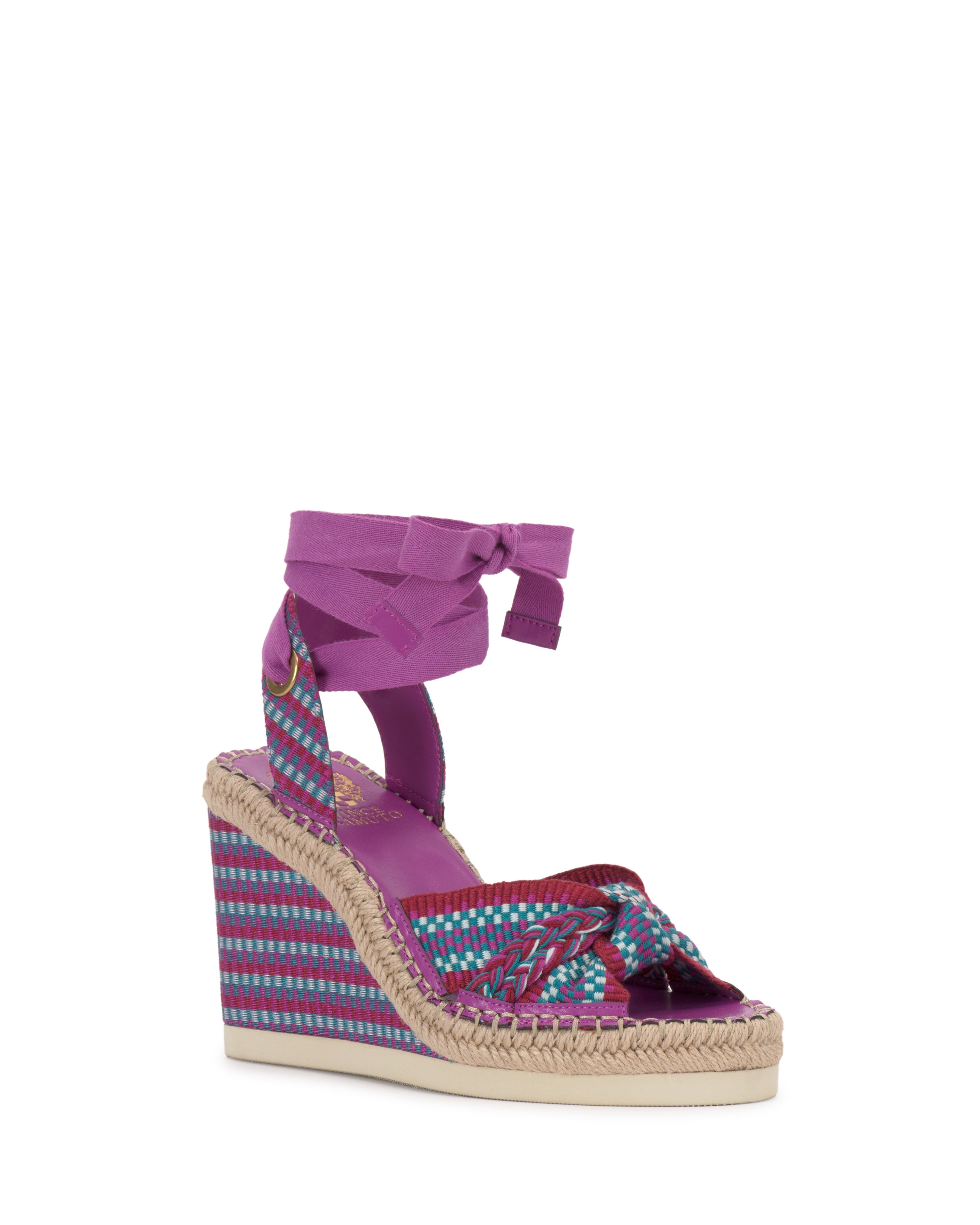 The Vince Camuto Bealie Wedge Sandal showcases a woven purple and turquoise bohemian pattern, braided front straps, a purple ankle tie, and an espadrille wedge heel with natural jute trim.