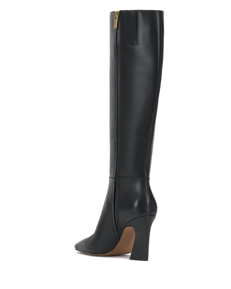 The Bennidy Narrow Calf Knee High Boot by Vince Camuto is shown in black leather with a pointed toe, high block heel, and a gold zipper at the top side, displayed against a white background.