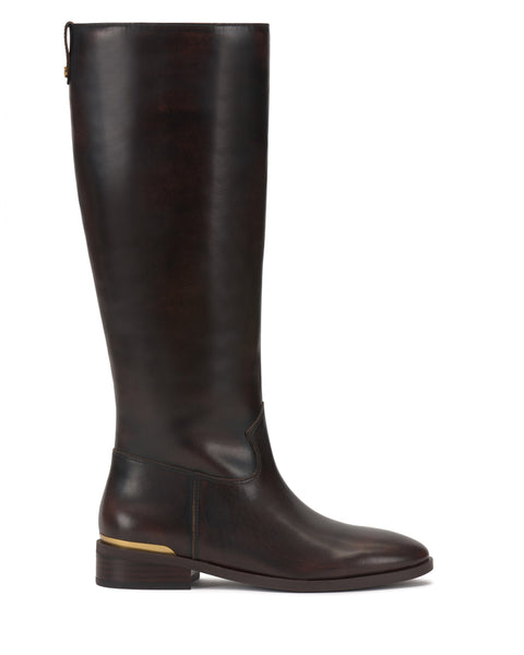 The Vince Camuto Bercla Narrow Calf Knee High Riding Boot is shown in side profile on a white background, featuring dark brown leather, western styling, a low heel, and a gold accent near the back.