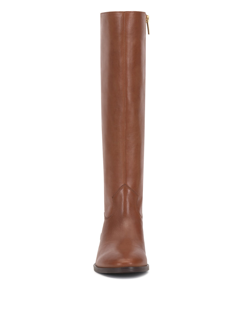 Front view of the Vince Camuto Bercla Wide Calf Knee High Riding Boot in brown leather, featuring western styling with a rounded toe and low heel, shown against a white background.