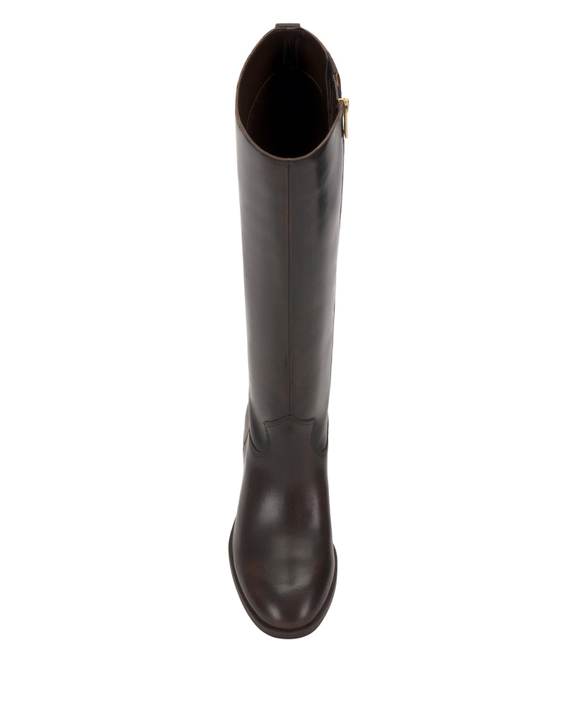 The Vince Camuto Bercla Knee High Riding Boot features dark brown leather, a rounded toe, and a knee-high shaft with a side zipper and gold buckle near the top. Shown from above on a plain white background.