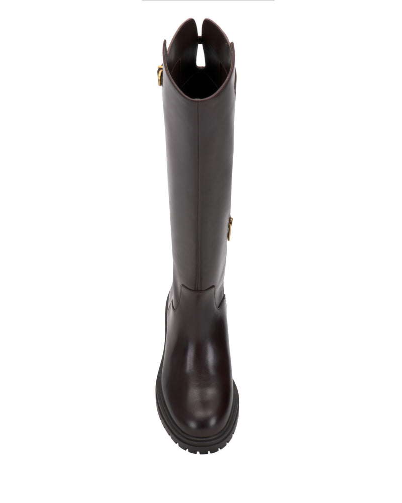 The Bertla Wide Calf Knee High Riding Boot by Vince Camuto is a tall, dark brown leather boot seen from above, featuring a rounded toe, textured sole, and a gold buckle detail near the top.
