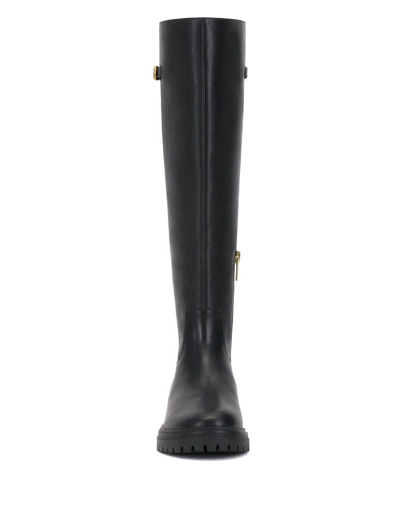 Front view of the Vince Camuto Bertla Knee High Riding Boot in black leather, featuring a rounded toe, a side zipper, and a buckle detail near the top. The boot is designed with a thick, textured sole for enhanced grip.