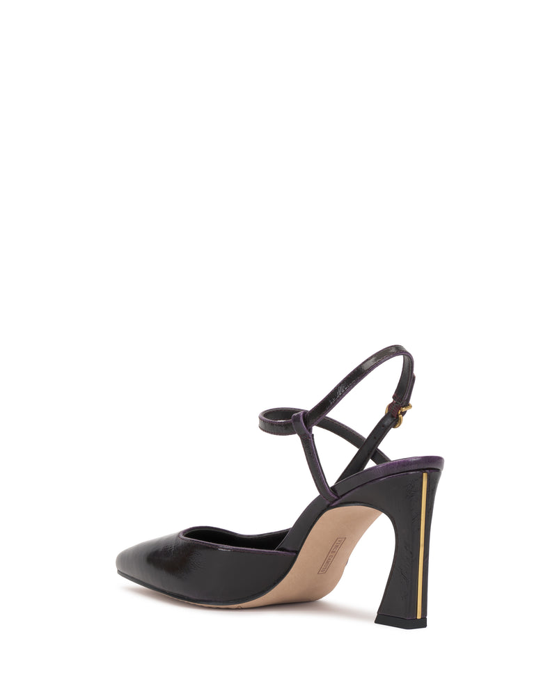 The Vince Camuto Bevarin Pump is a single black high-heeled shoe featuring a pointed toe, an ankle strap, and a gold accent on the heel, displayed against a white background.