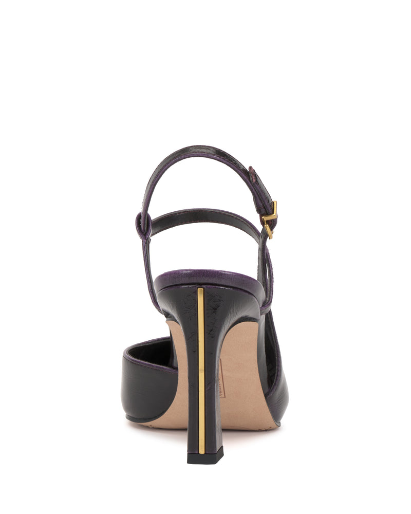 The Vince Camuto Bevarin Pump is a black high-heeled sandal seen from the back, showcasing a gold accent along the heel and an ankle strap with a small buckle.