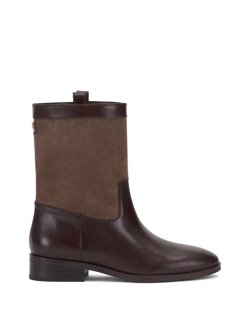 The Bezzley Bootie by Vince Camuto features a brown leather lower section, a suede upper, a low block heel, and a pull tab at the top.