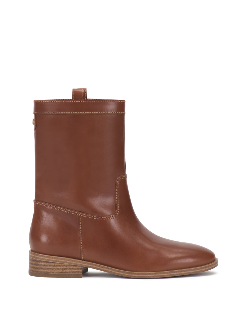 Introducing the Vince Camuto Bezzley Bootie—a brown leather mid-calf boot featuring a smooth finish, rounded toe, low stacked heel, side stitching details, and a convenient pull tab at the top.