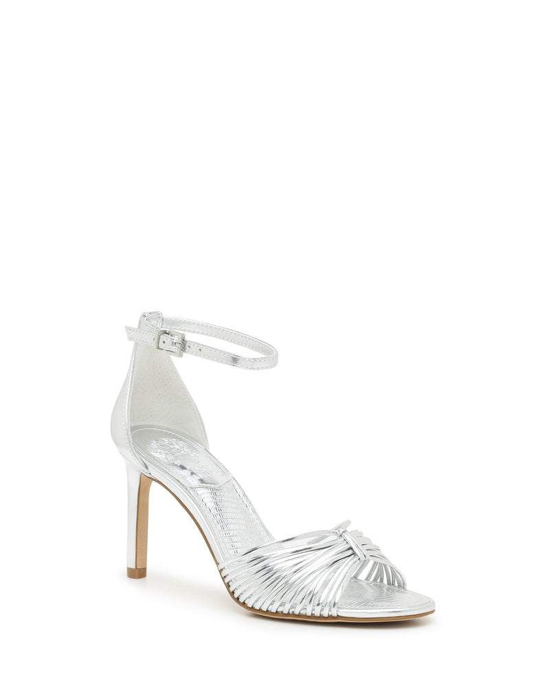 Vince Camuto Blaine Sandal in silver: an open-toe stiletto with thin, knotted straps across the toe and an adjustable ankle strap.