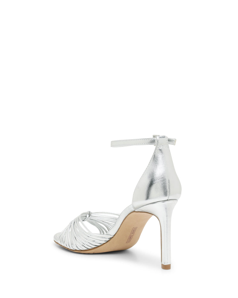 Vince Camuto Blaine Sandal in metallic silver, featuring a tall heel, thin straps across the toe, and an ankle strap with a buckle.